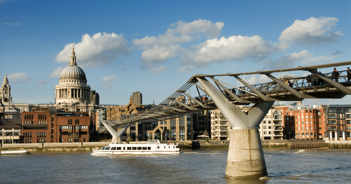 View from River Thames of the millennium bridge and St Paul's Cathedral 