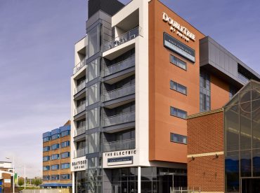 An exterior photograph of the DoubleTree by Hilton in Lincoln by the Brayford Waterfront