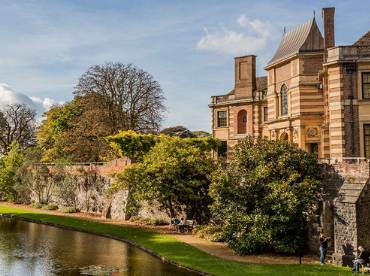 The exterior of Eltham Palace, surrounded by the beautiful gardens and moat.