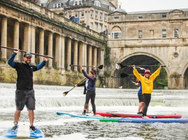 People paddleboarding on the River Avon in Bath.